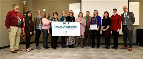 Fairview Middle School Principal & Staff, CKSD Superintendent & Board President, OESD Superintendent with banner 
