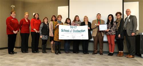 CKSD Board, Silver Ridge Staff & Principal, Superintendent CKSD, and OESD Superintendent with banner 